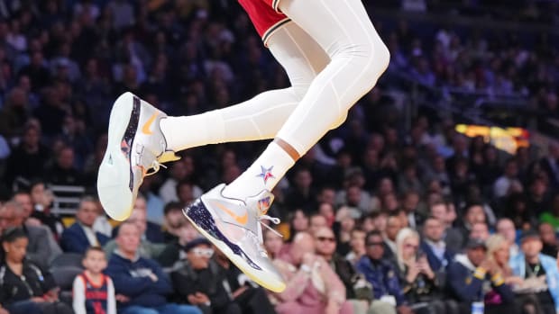 Kevin Durant's silver and orange Nike shoes worn in the 2024 NBA All-Star Game.